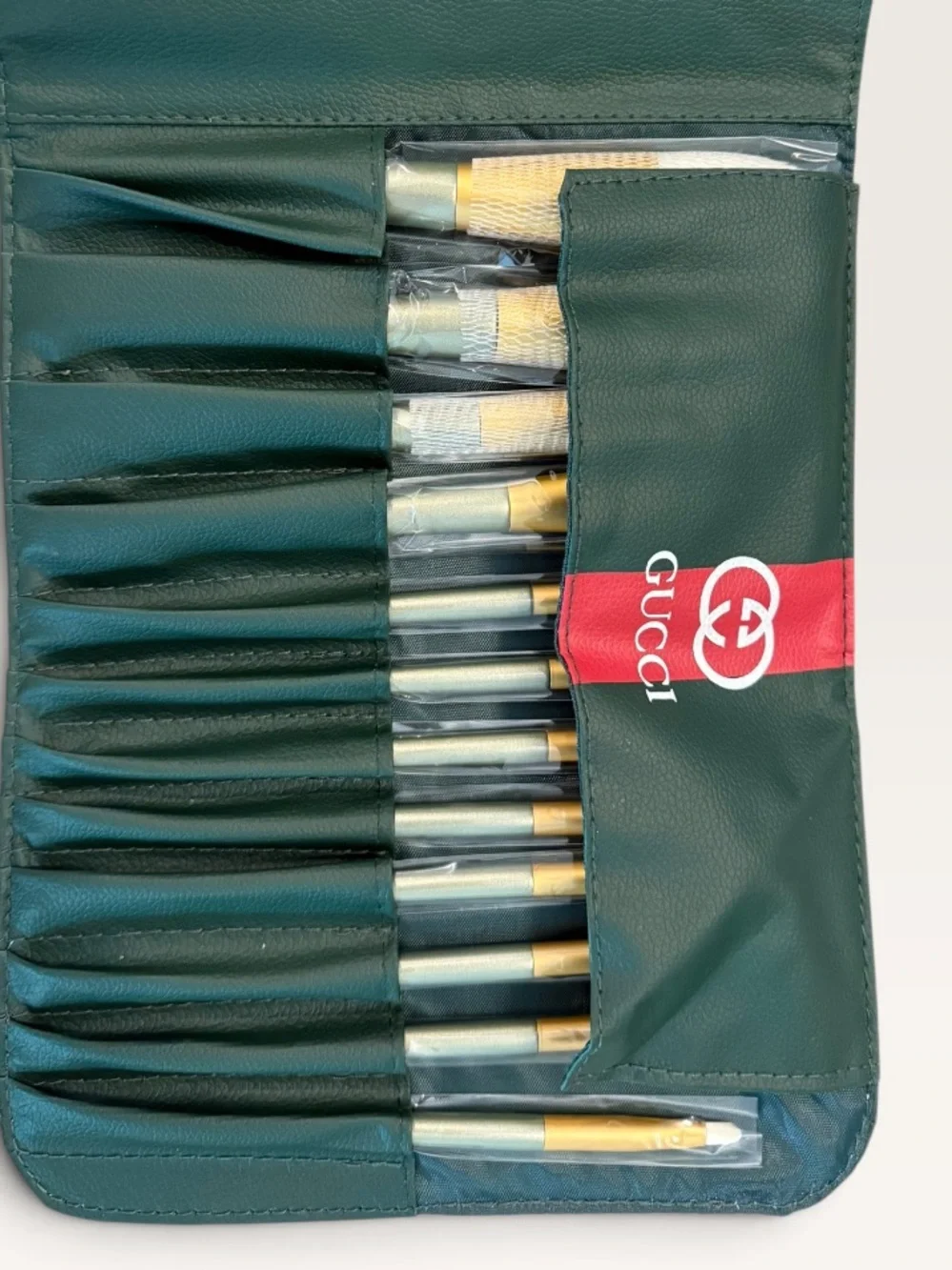 Source Unknown Green Brush Roll with Red Stripe and Gold-Tone Brushes